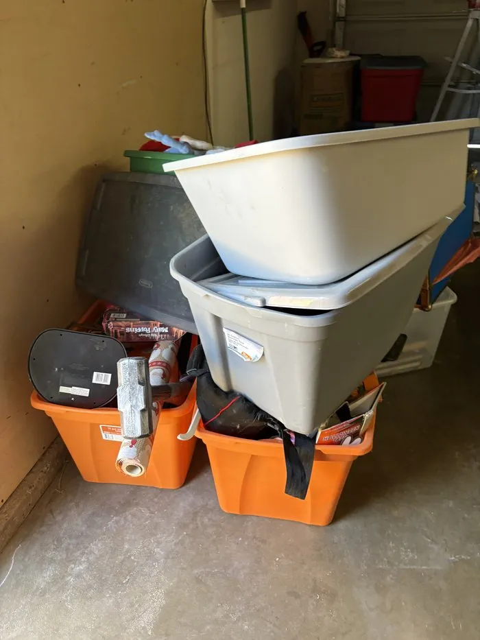 Stacked storage bins and holiday decor hauled away by MZM Junk Removal in Carmichael, CA 95608