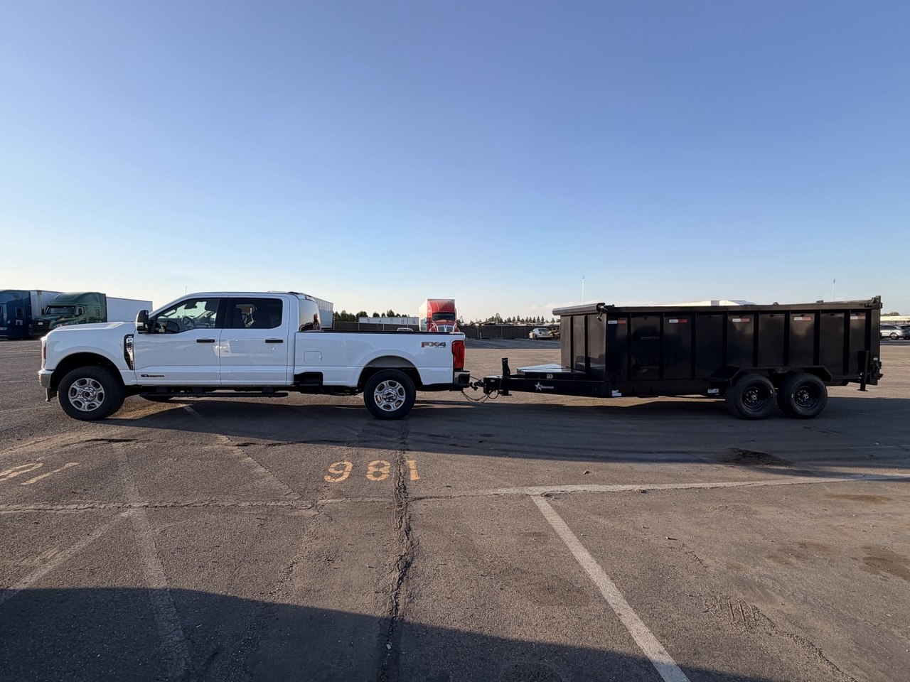 MZM Ford F-250 with black dump trailer