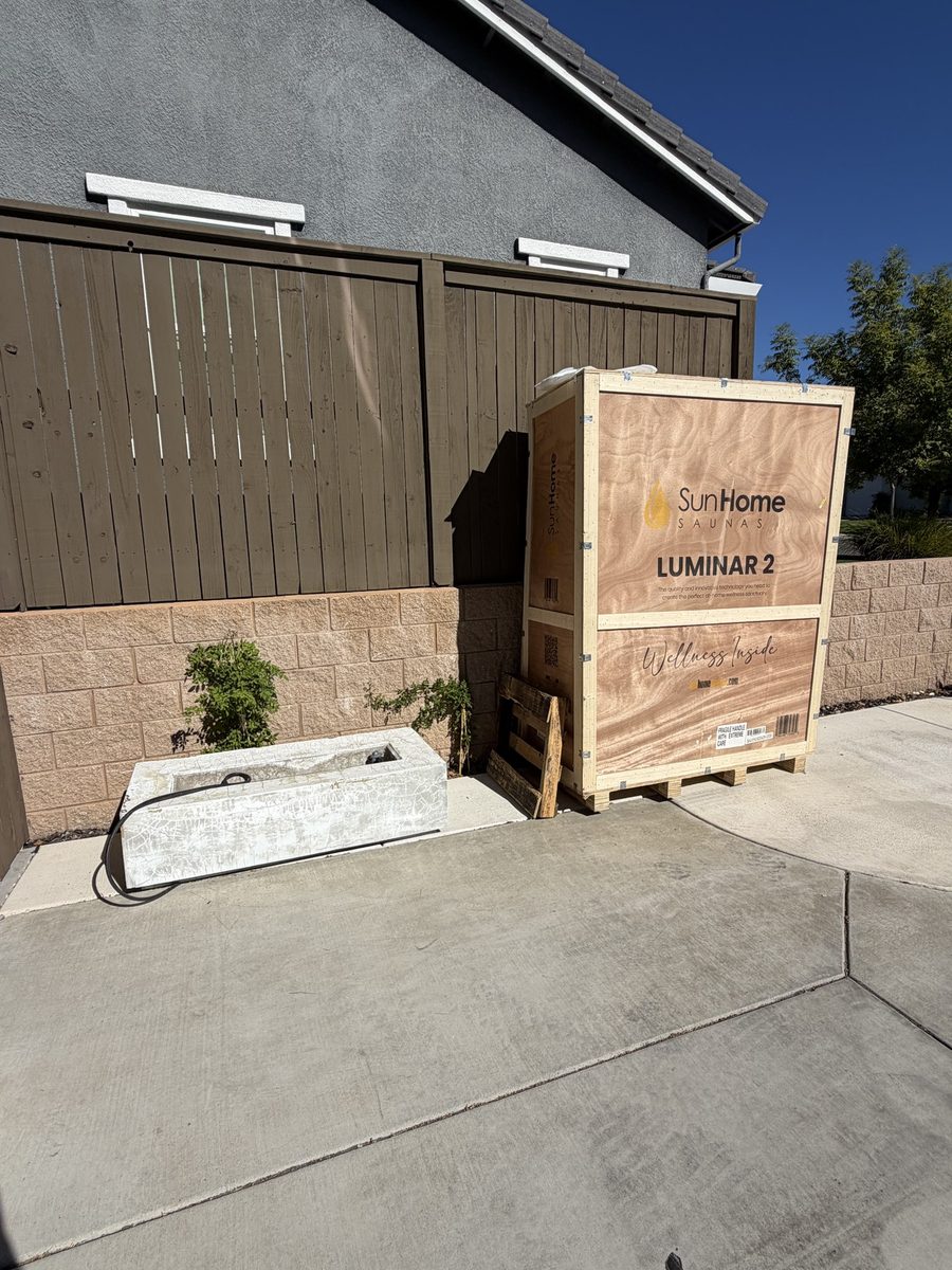 MZM Junk Removal hauling away a large sauna shipping crate in Rocklin, CA