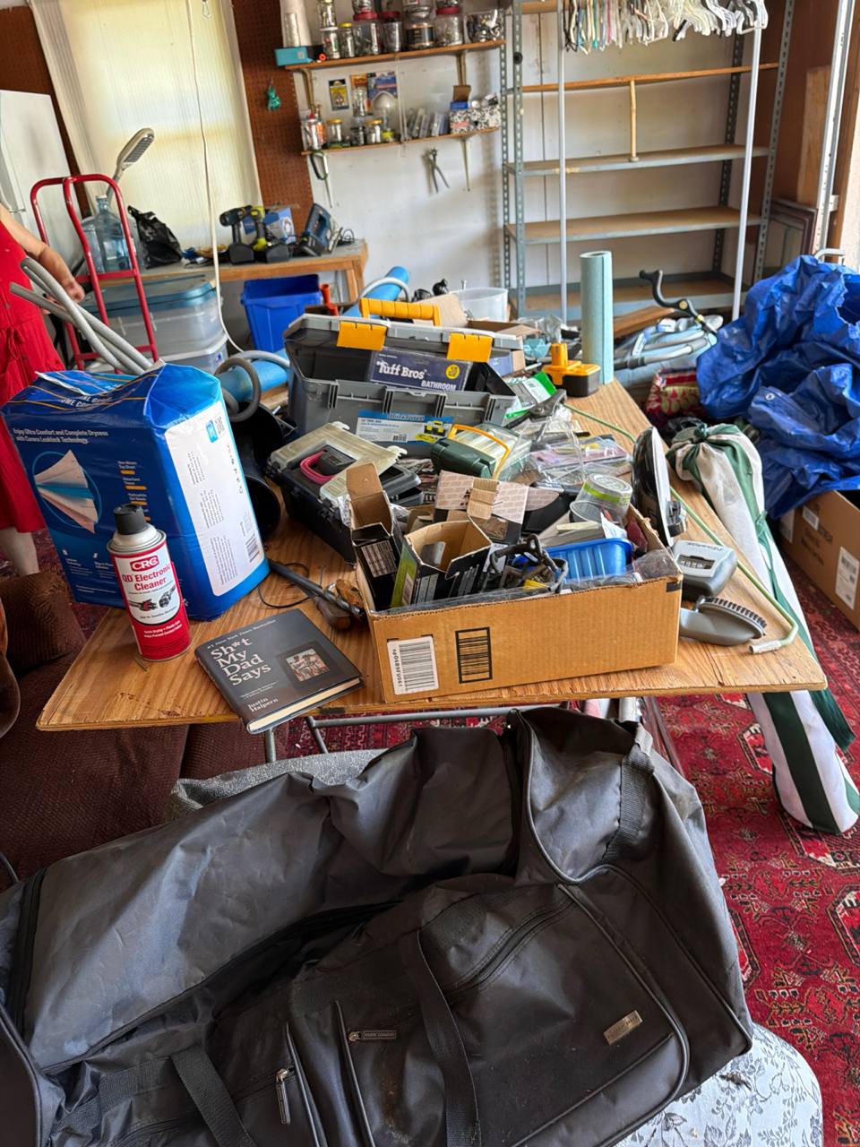 Cluttered garage cleared by MZM Junk Removal