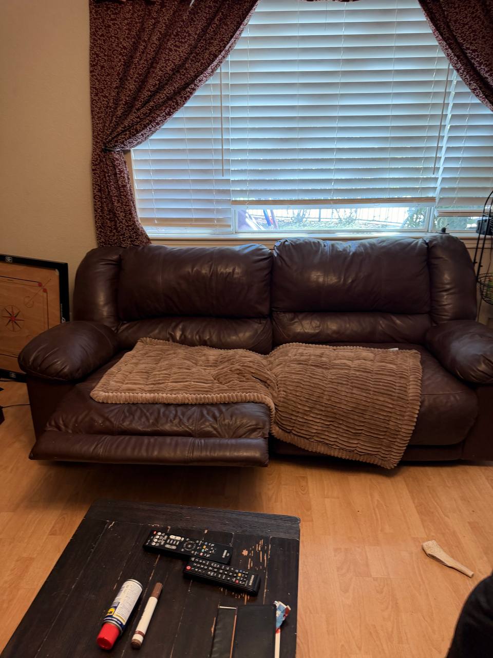 Leather reclining sofa cleared during an estate cleanout