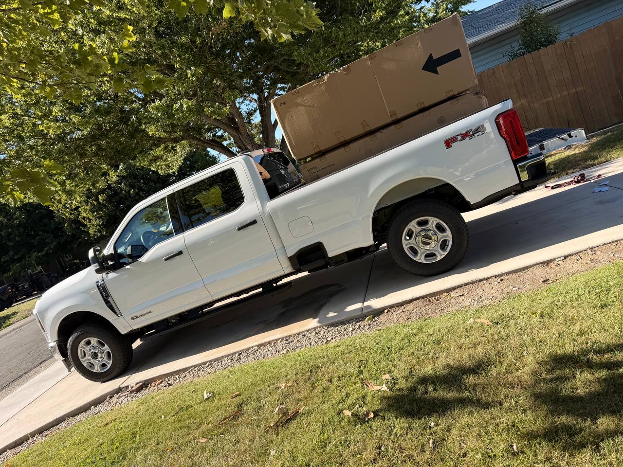 Furniture boxed and loaded into MZM Junk Removal truck bed